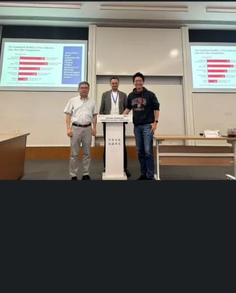 Dr. Joshua Lau speaking on stage