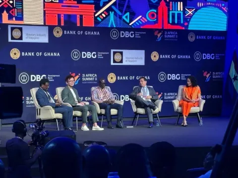 Michael Low speaking on stage