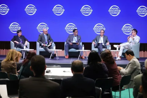 Michael Low speaking on stage