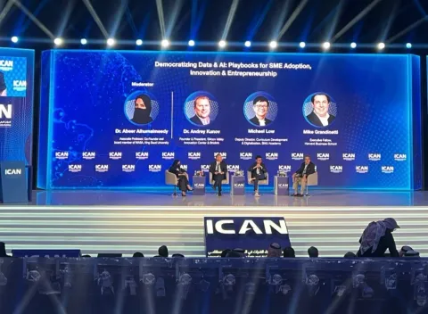 Michael Low speaking on stage