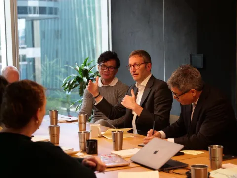 Michael Low speaking on stage